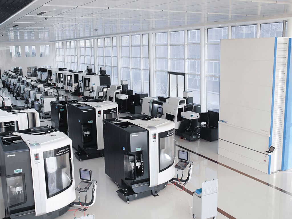 Kangli's CNC machining hall lined with DMG 5-axis machining centres in a bright, clean workshop with floor-to-ceiling windows