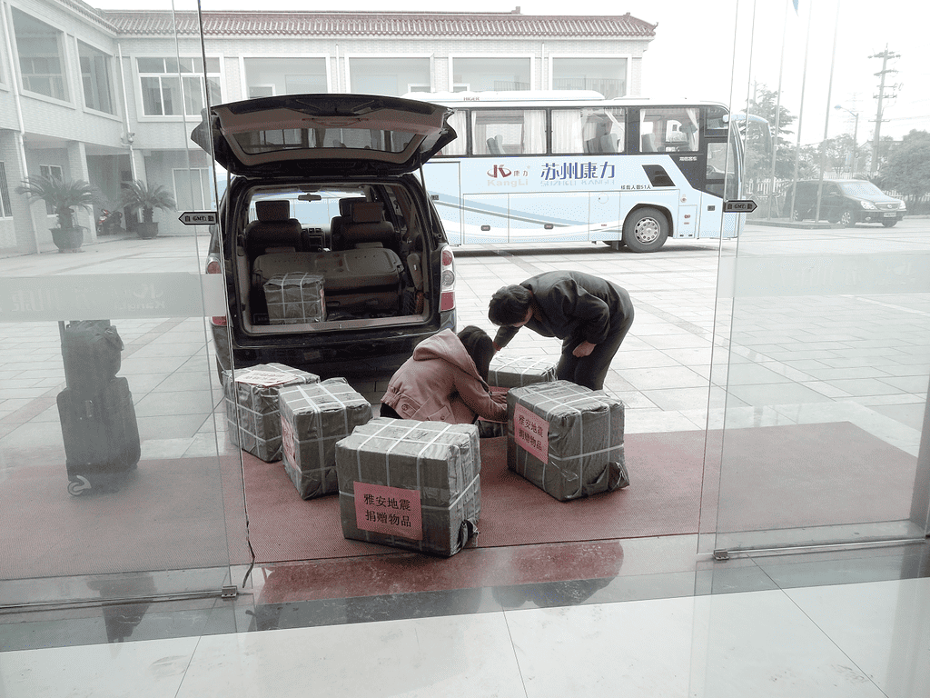 Kangli staff are counting the donated supplies for the Yaan Earthquake relief efforts.